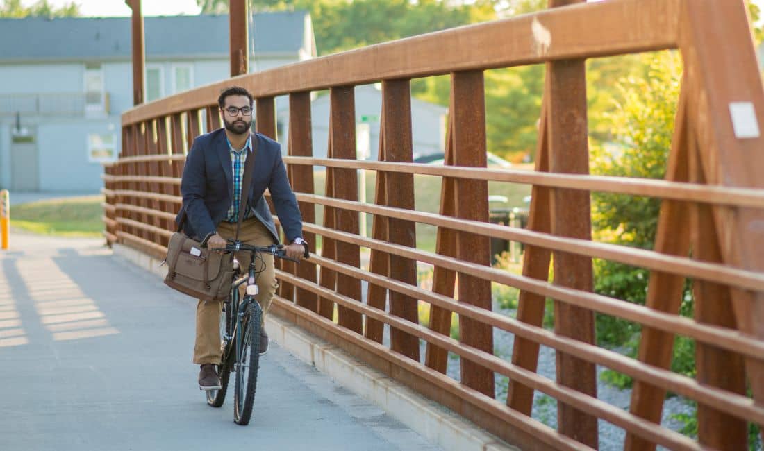 Man getting more daily movement in by riding his bike to work